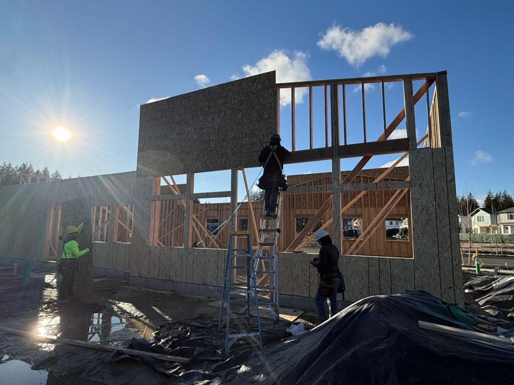 Front entrance Building A for McCormick Village Retail being actively built by construction team