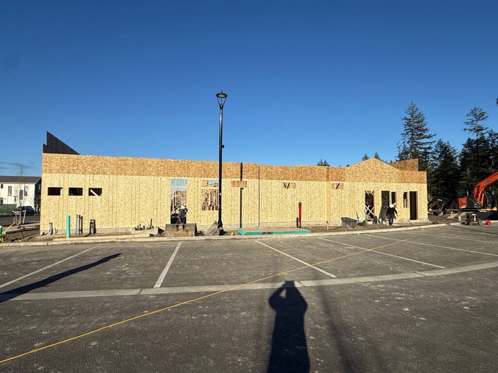 New building framed in McCormick Village Retail in Port Orchard, WA.